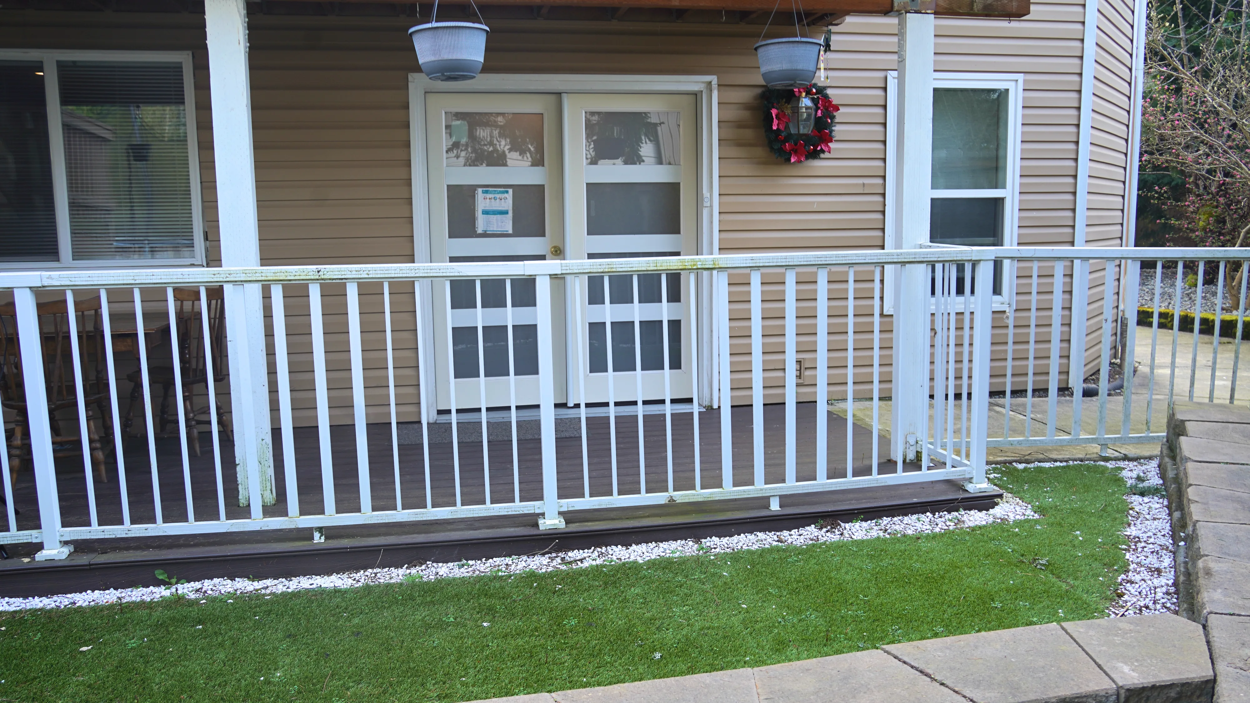 Front porch with white railing and accessible entry