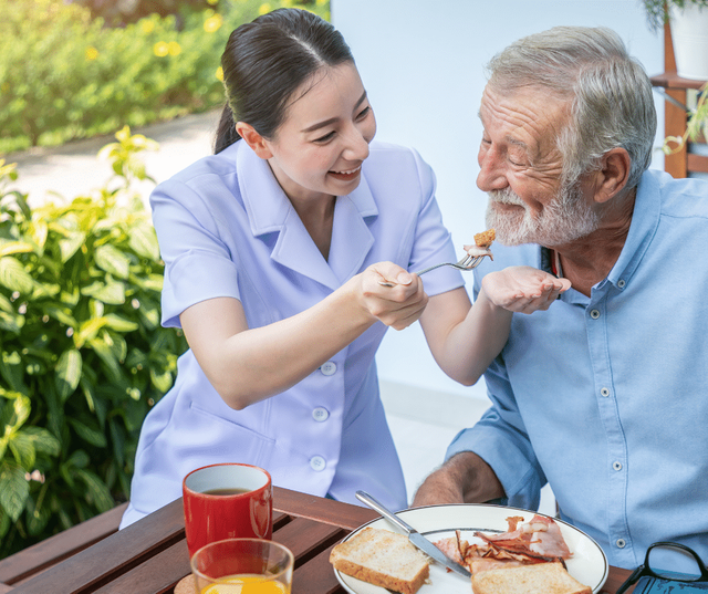 Caregiver helping resident with mobility